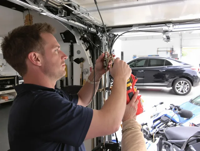 Carson Garage Door Repair safety certified technician performing cable replacement in Carson