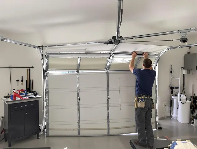 Carson Garage Door Repair specialist performing precise section replacement on Carson garage door